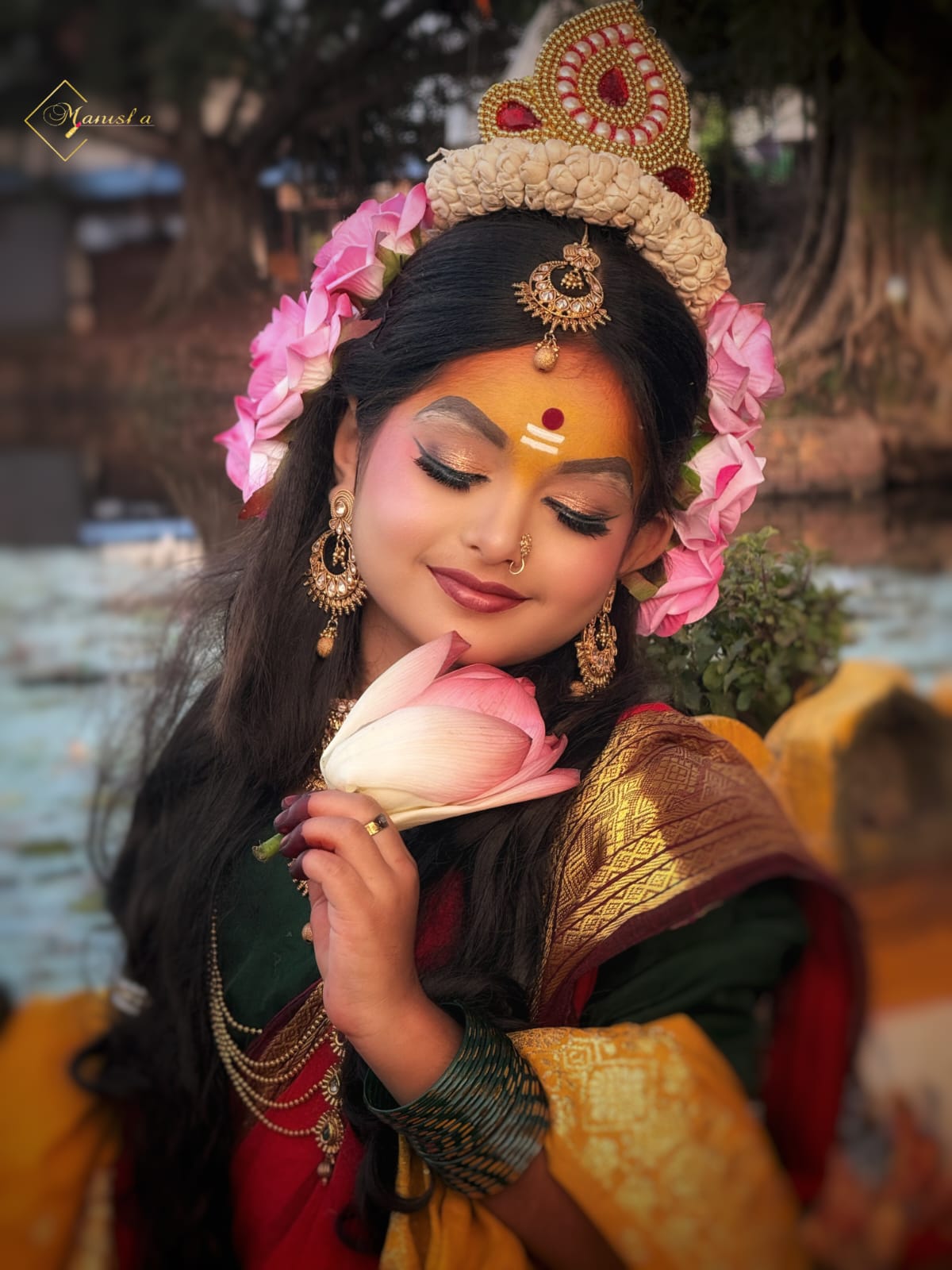 Indian bride with elegant gold-toned bridal makeup and traditional jewellery